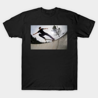 Skateboarder doing a tail slide T-Shirt